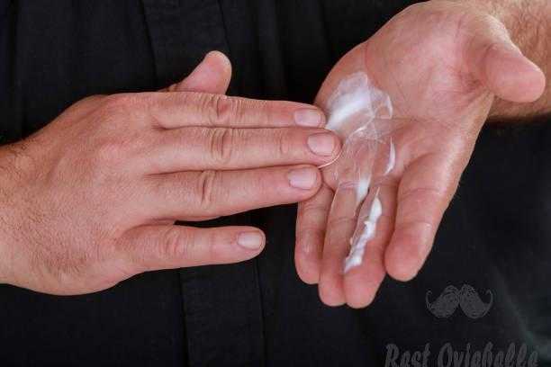 Cosmetician man hand with cream on hands How To Applying And Using A Hand Lotion