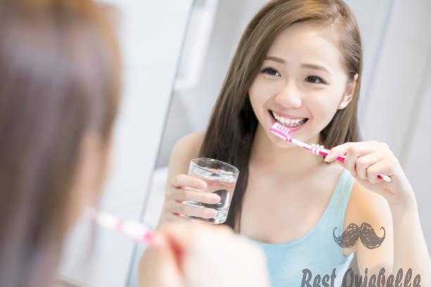 woman take tooth brush whitening mouthwashes
