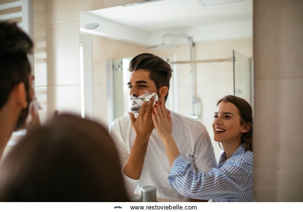 Young couple goofing around with shaving foam